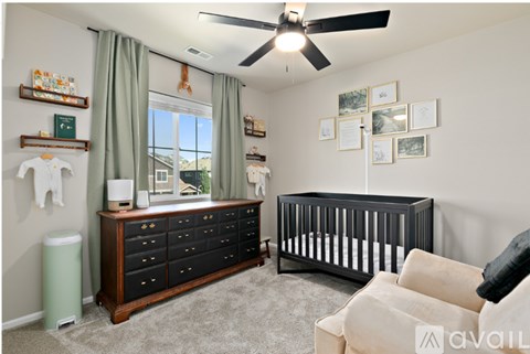 A baby room with a crib and a dresser.