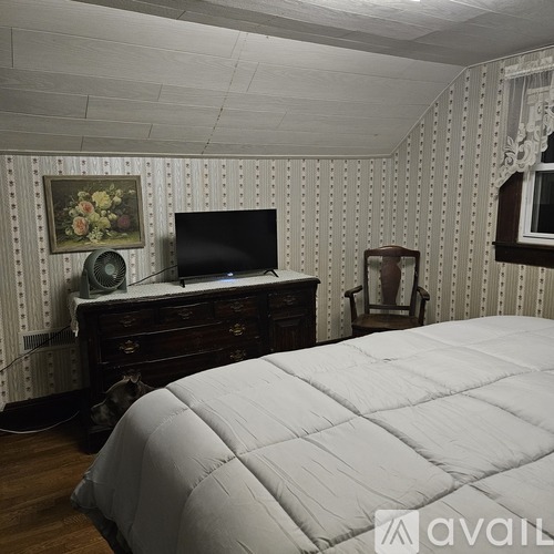 A bathroom with a toilet, sink, and bathtub.