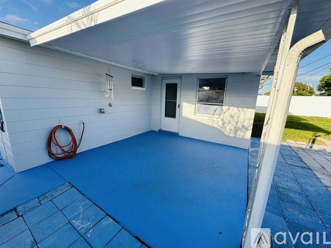A house with a blue floor and a white wall.