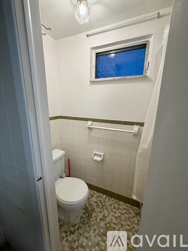 A blue pool under a white canopy.