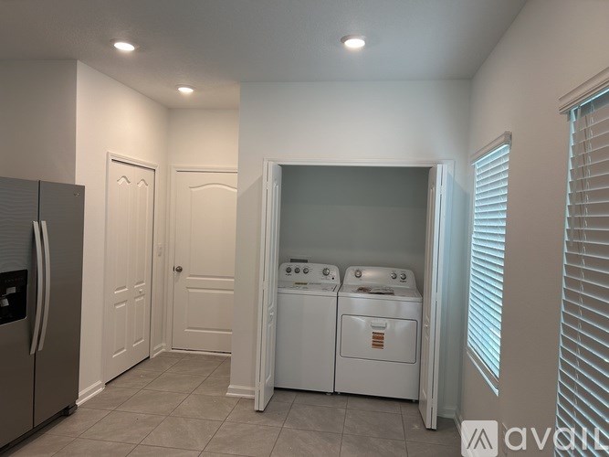 A laundry room with a washer and dryer.