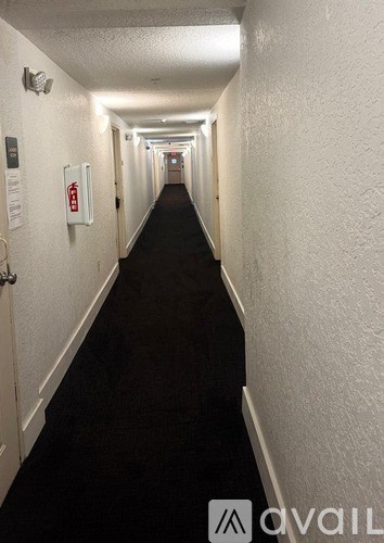 A long hallway with doors on both sides.