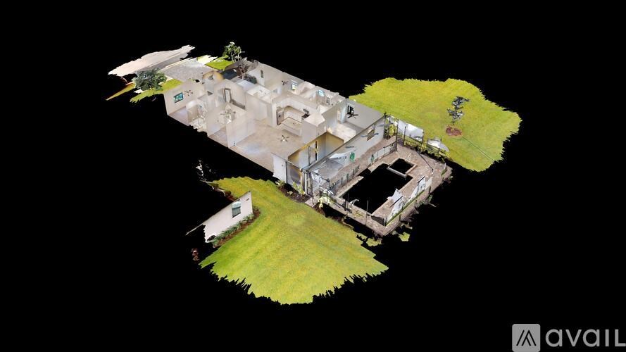 A bird's eye view of a house with a large lawn and a smaller house in the back.