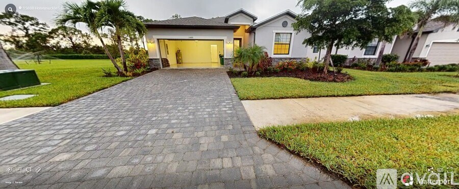A house with a driveway in front of it.