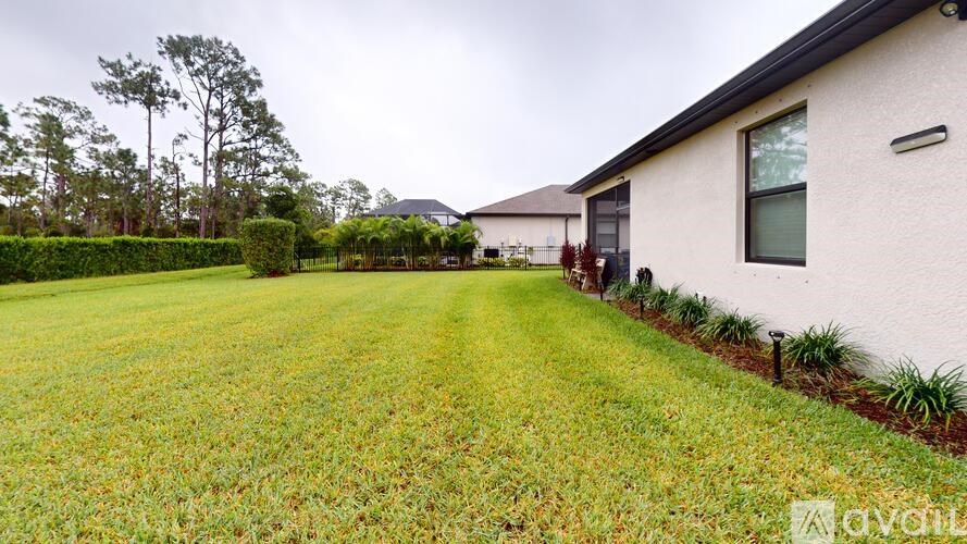 A house with a lawn in front of it.