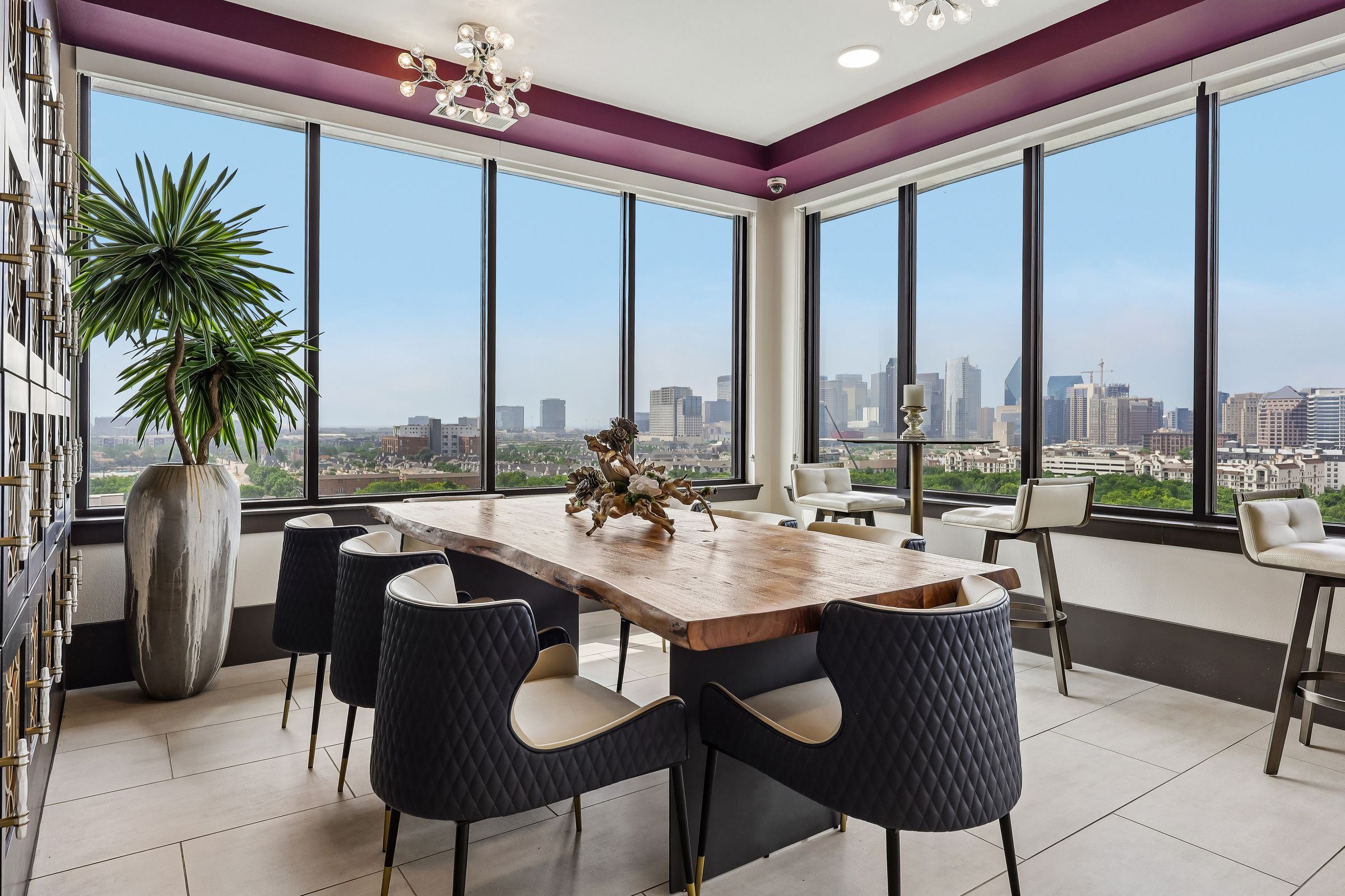 A dining room with a view of the city skyline.