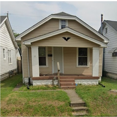 A small house with a front porch and a door.