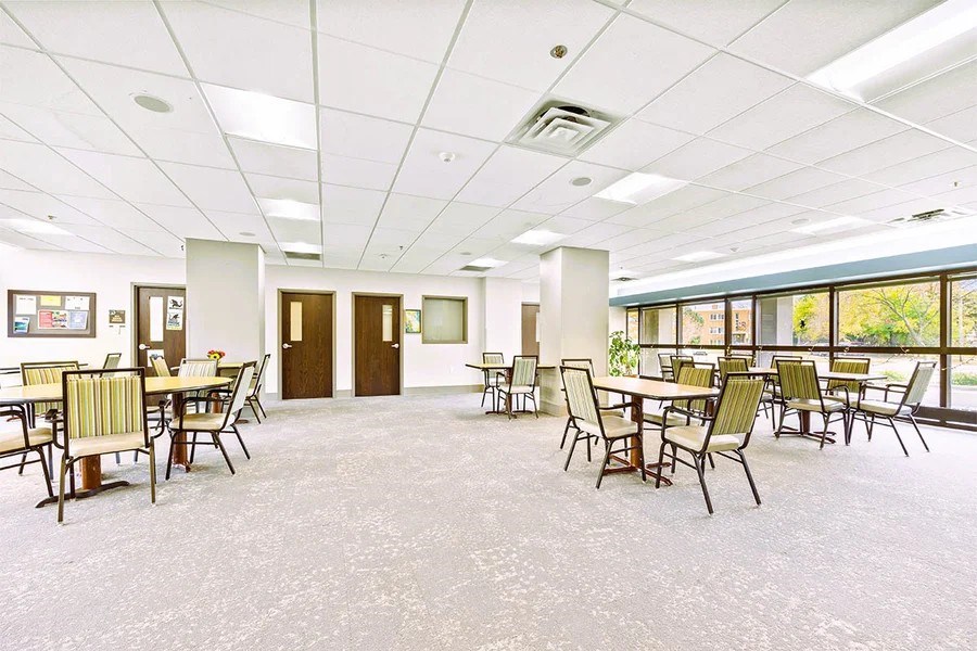 A large room with tables and chairs.