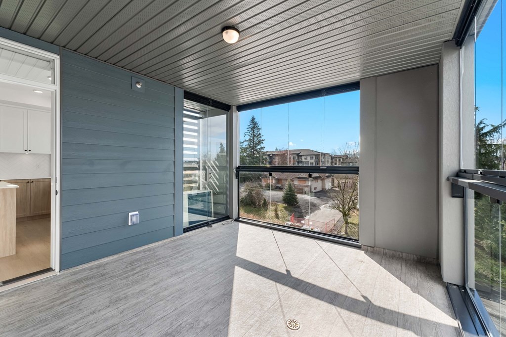 A balcony with a view of a residential area.