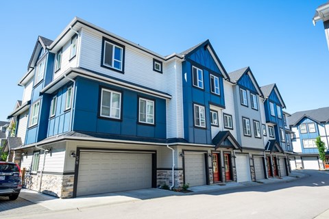 A row of houses with blue and white exteriors.
