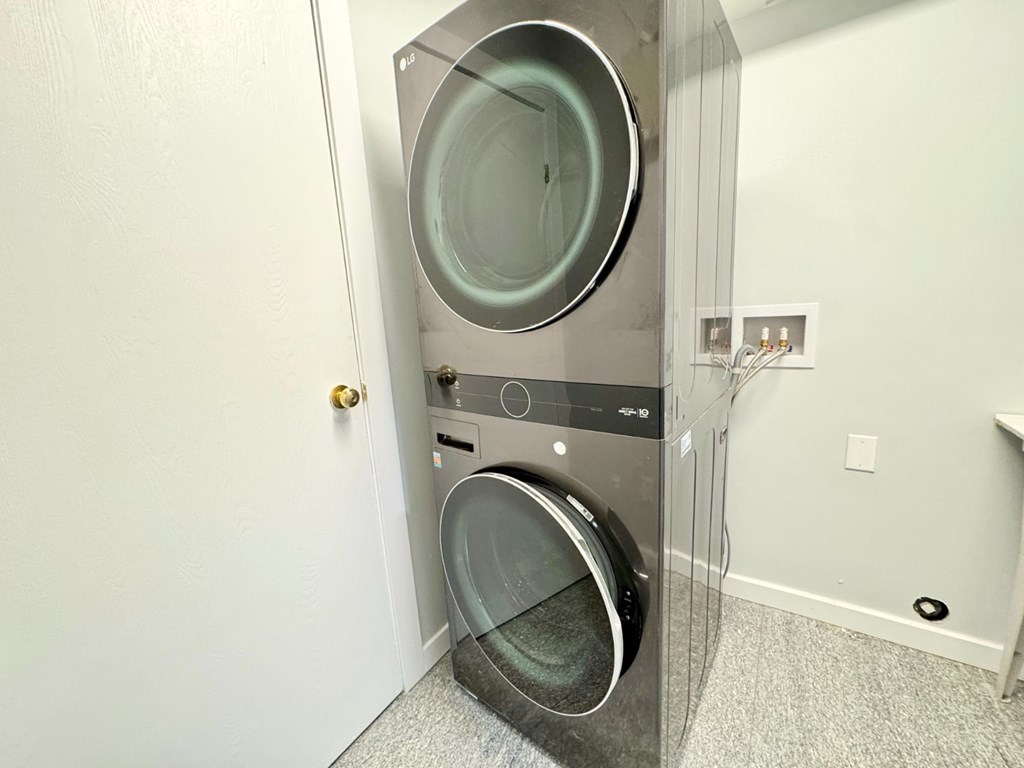 A washing machine is in a small room.