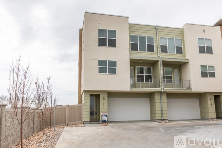 A two-story building with a garage on the ground floor.