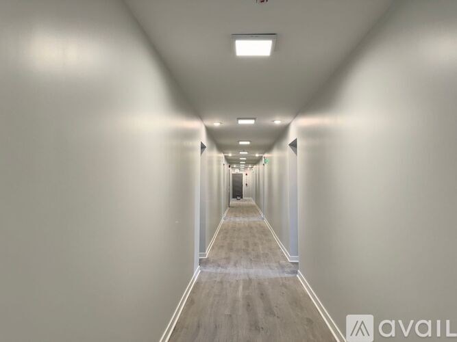 A long hallway with a light at the end.