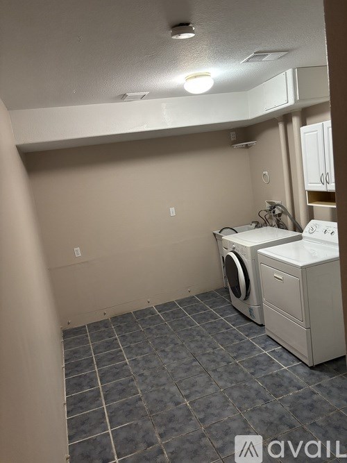 A house with a grey and blue exterior is available for rent.