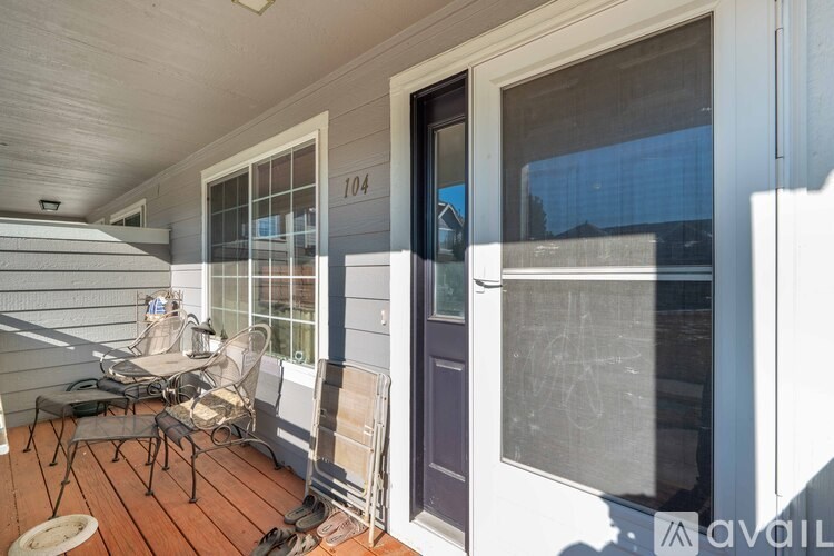 A patio with a table and chairs is available.