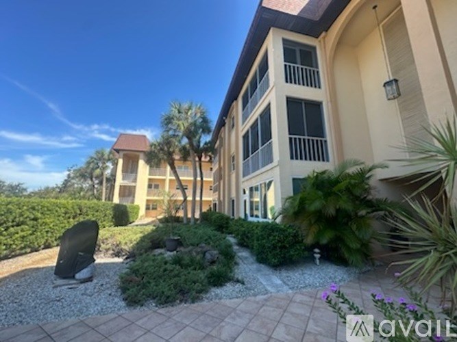 A building with a garden in front of it.