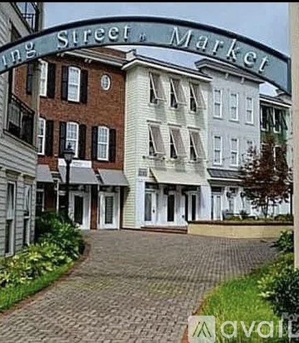 A street view of a market with a sign that reads "Long Street Market".