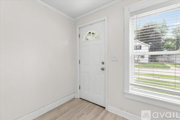 A white door with a window on the side.