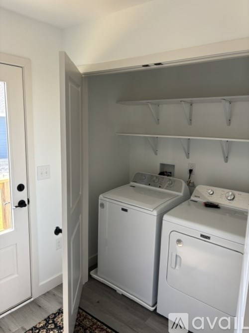 A laundry room with a washer and dryer.