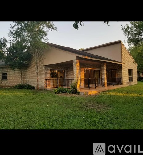 A house with a large front porch and a covered patio area.