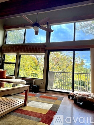 A house with blue doors and a brown roof.