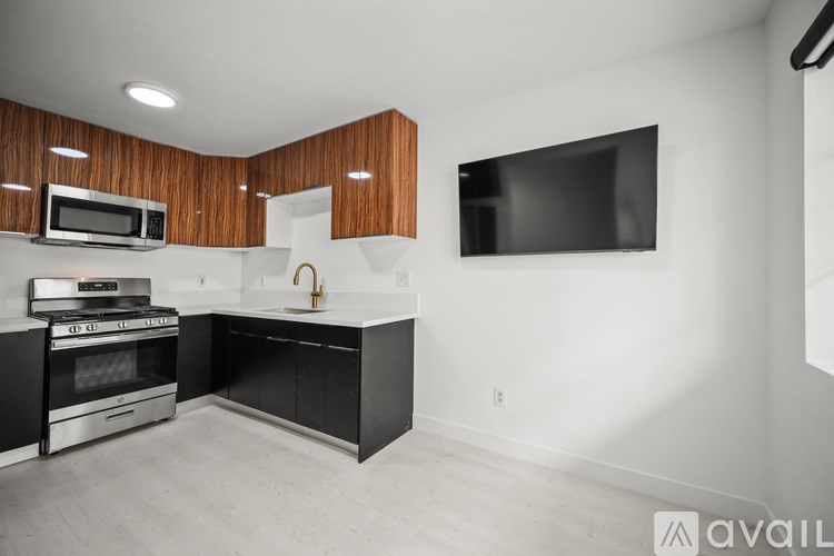 A modern kitchen with a black and white color scheme.