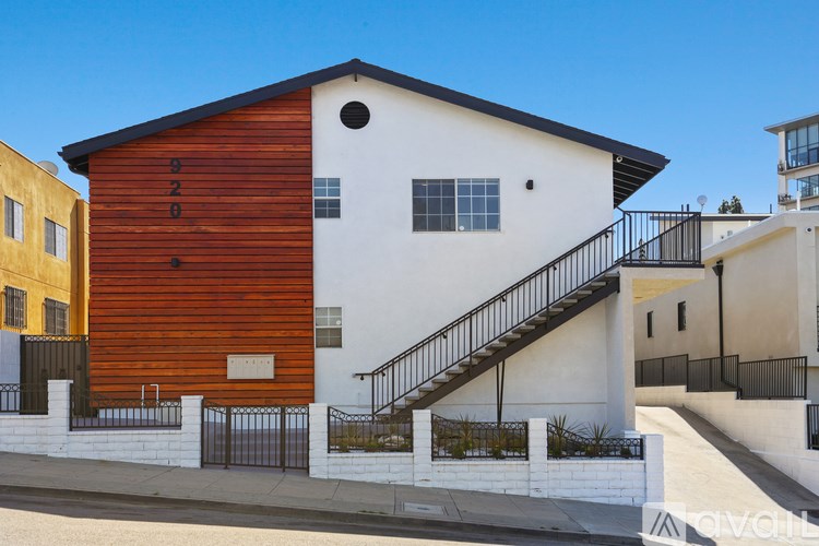 A modern house with a wooden exterior and a white interior.