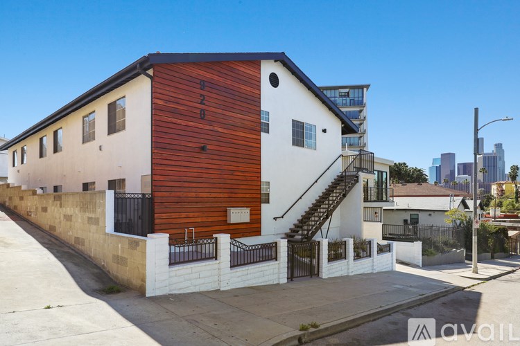 A modern house with a wooden facade is for sale.