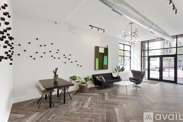 A living room with a dining table and chairs.