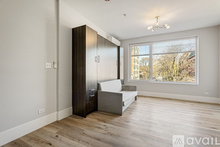 A room with a large bed and a wardrobe is available for rent.