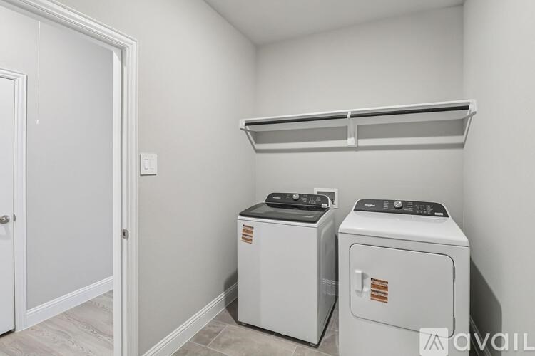 A laundry room with a washer and dryer.