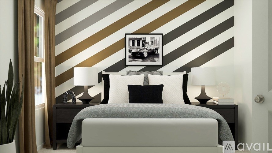 A bedroom with a bed, nightstands, and a striped wallpaper.