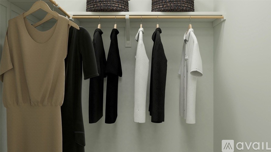 Clothes hanging on a clothes rack.