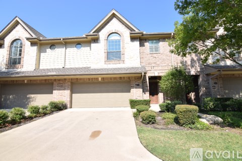 A house with a driveway in front of it.