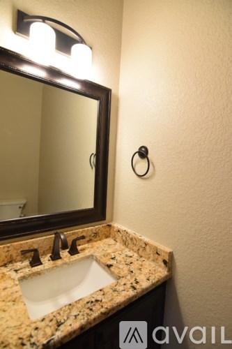 A bathroom sink with a mirror above it.