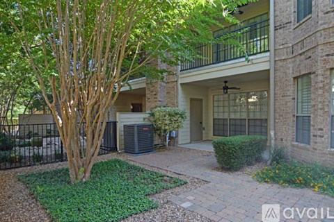 A pool surrounded by trees and chairs.