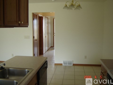 A kitchen with a sink and a counter.