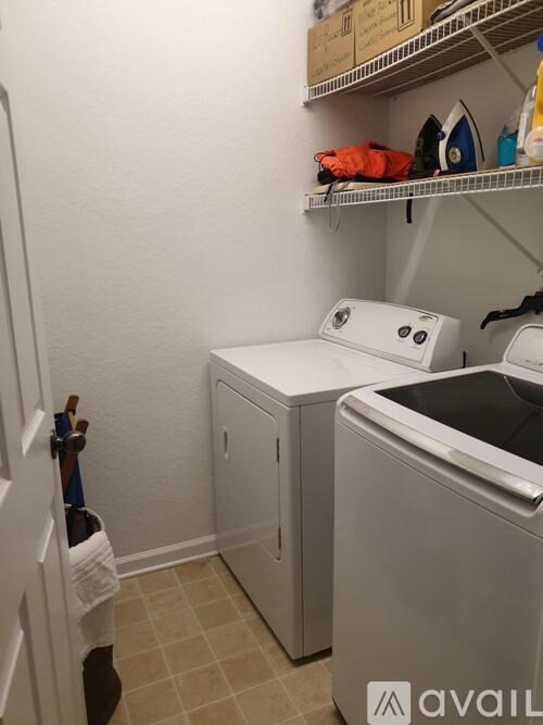 A laundry room with a washer and dryer.