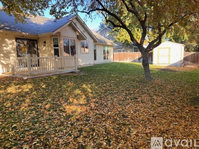 A house with a tree in front of it.