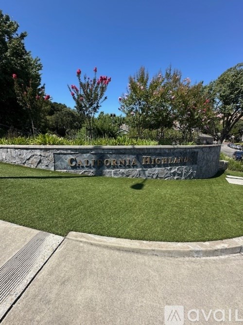 A stone wall with the words "Dartmouth Highlands" engraved on it.