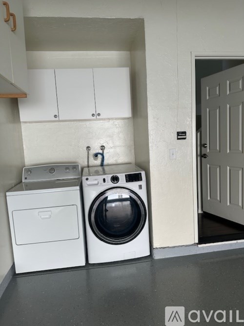 A washer and dryer in a laundry room.