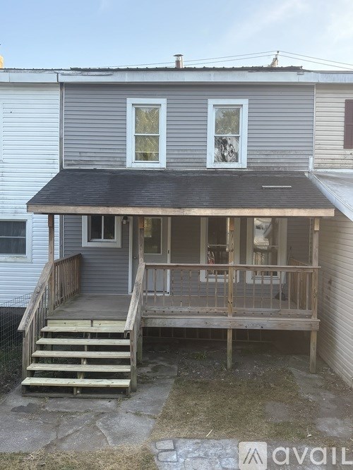 A house with a porch and a covered entrance.