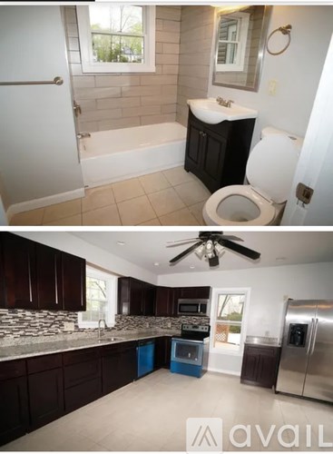 A bathroom with a toilet, sink, and bathtub.