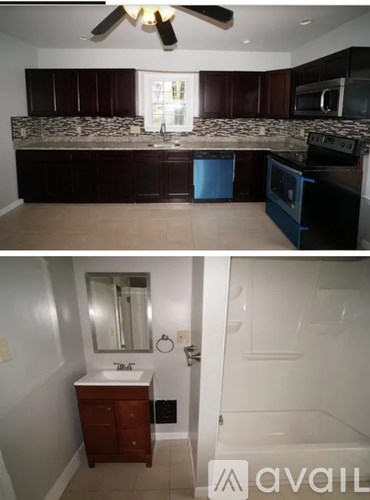 A bathroom with a white sink and a white bathtub.