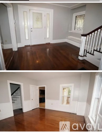 A white door with a glass window is in the middle of a room.