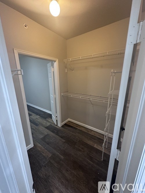 A room with a grey floor and white walls.