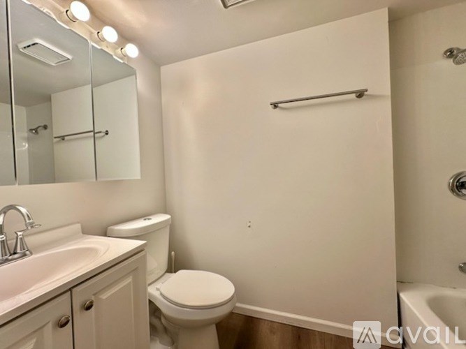 A black SUV is parked in a parking lot.