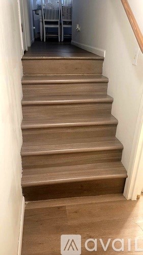 A set of stairs leading up to a dining area.