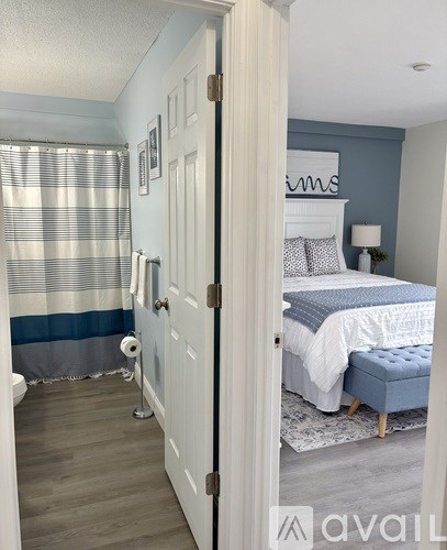 A bedroom with a bed and a toilet.