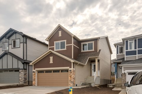 A modern house with a garage is shown in the image.